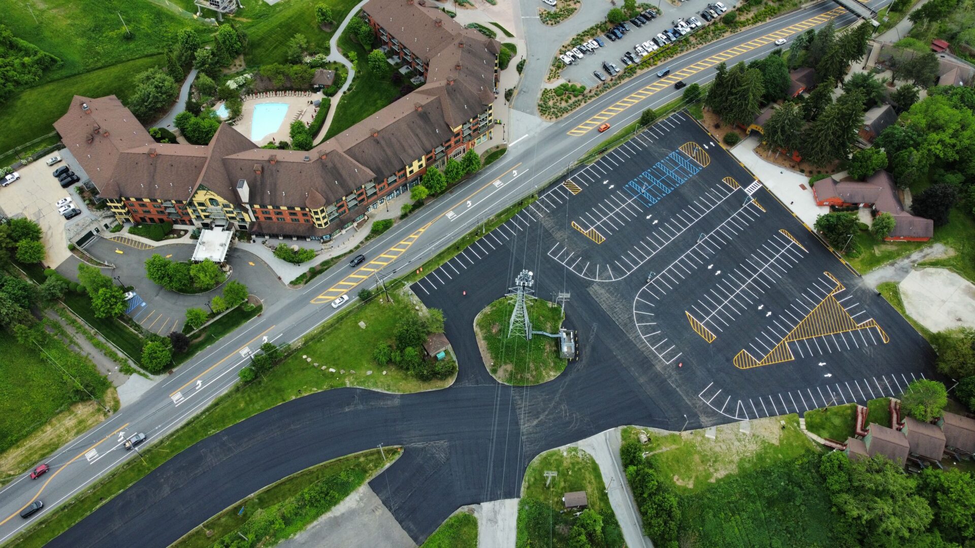 An ariel view of a large parking space with streetlights